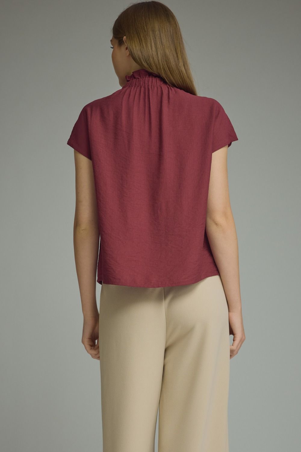 Burgundy cap sleeve top with ruffled split neckline