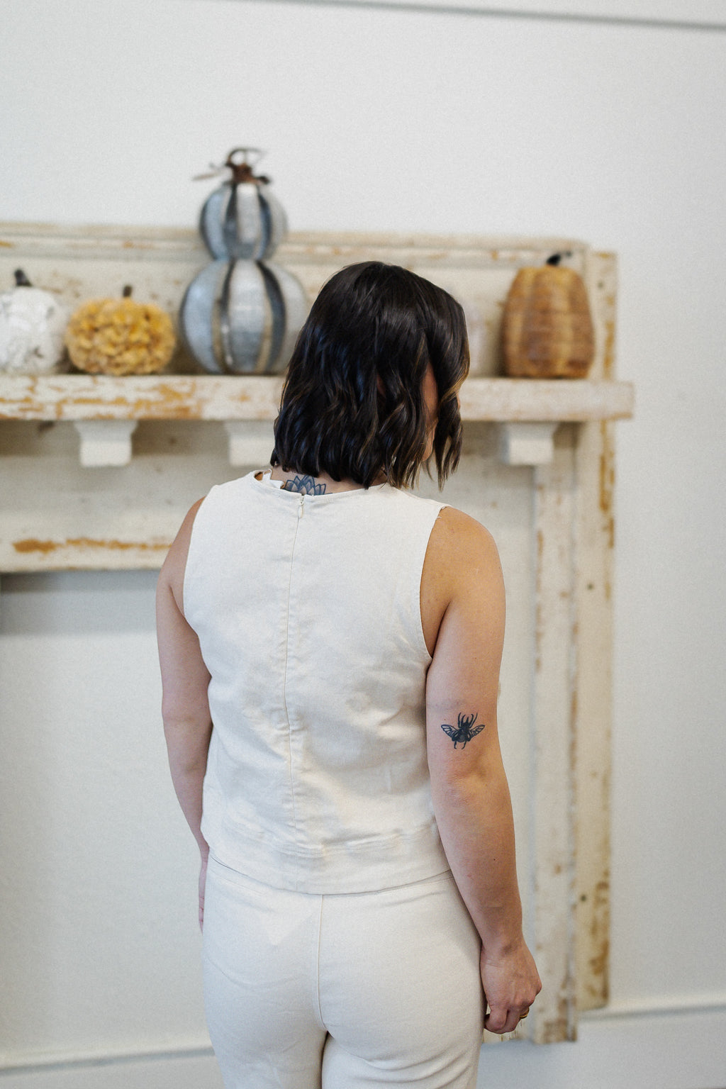Ivory Sleeveless Top with Gold Hardware